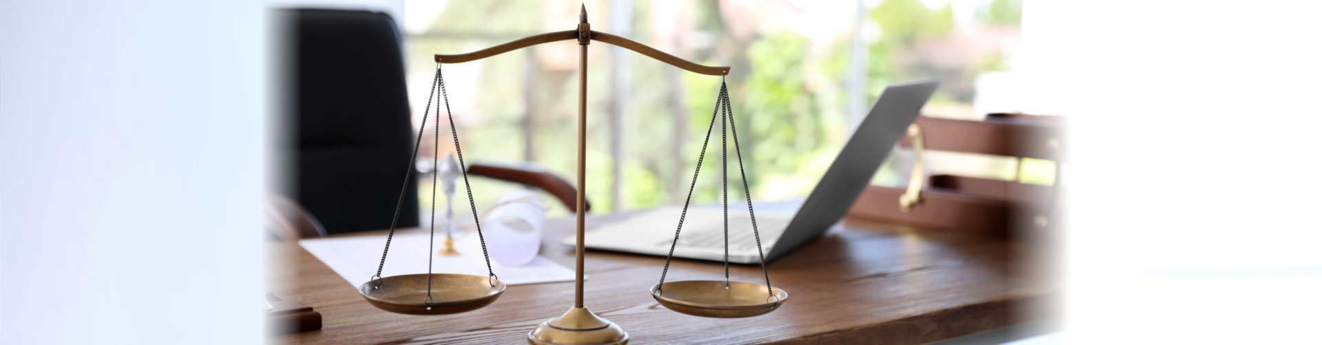 Scales of justice on desk in notary`s office